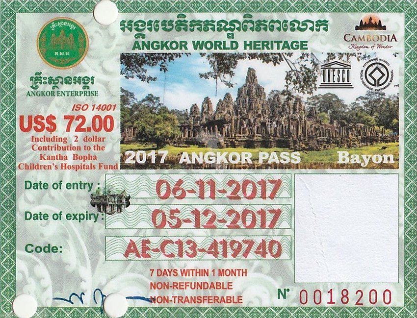 7days-angkor-ticket Ancient Angkor Wat temple silhouette at sunrise in Siem Reap, Cambodia, with reflection in the water, showcasing unique Khmer architecture and sunrise views for ideal Angkor exploration.